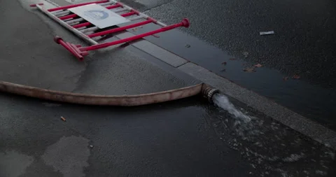 Fire hose on wet road Video stock 318073579