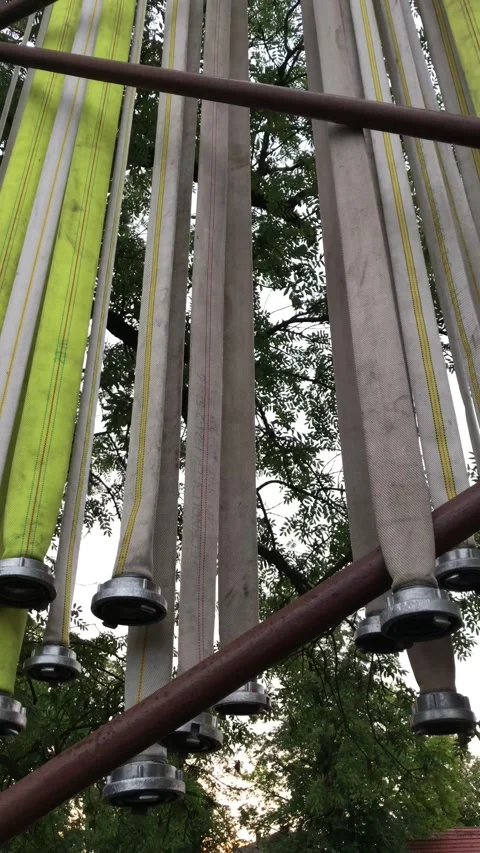 Fire hoses hanging outside Stockbeeldmateriaal 248176741
