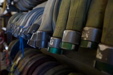 Fire hoses hanging on wall - close up 스톡 사진