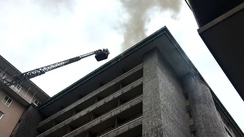 Fire in hotel firefighters extinguish Stock Footage 130077391