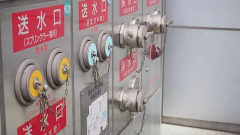 Fire Hydrant Cap and Plug With Chain for emergency fire rescue in japan.. Stock Photos