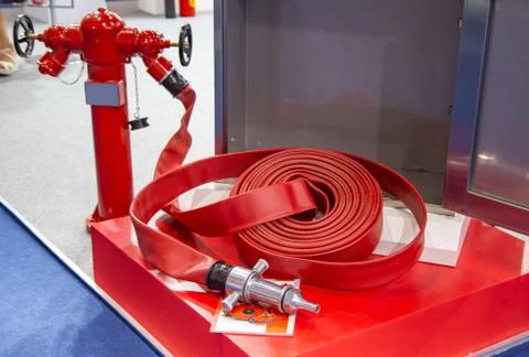Fire Hydrant With Fire Hose Stock Photos