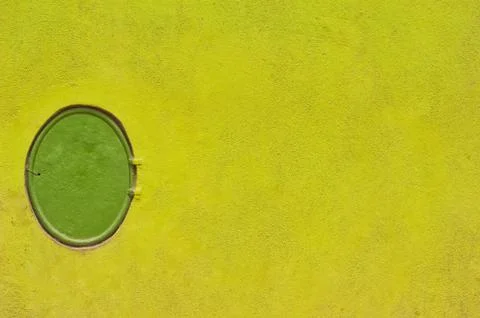 Fire hydrant on green wall. Stock Photos