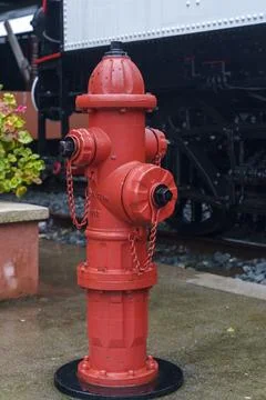Fire Hydrant Installed on Wet Urban City Street Stock Photos