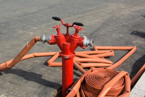 The fire hydrant with interconnected fire hoses. Stock Photos