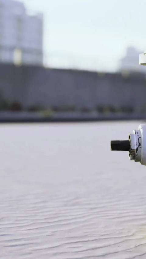 Fire hydrant located on a sidewalk near buildings during daytime Stock Footage 336583598