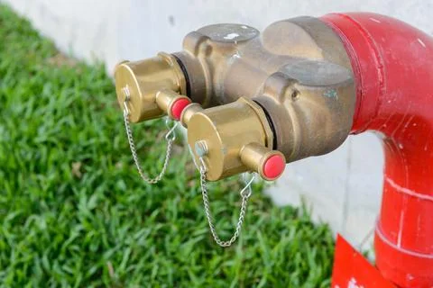 Fire hydrant manifold two outlet water valve. Fire department connection Stock Photos