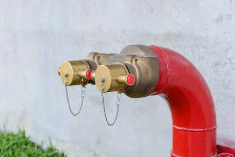 Fire hydrant manifold two outlet water valve. Fire department connection Stock Photos