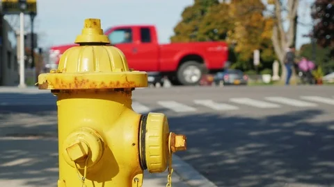 Fire hydrant in a small US town. Clear summer day, back street with heavy Stock Footage 71070528