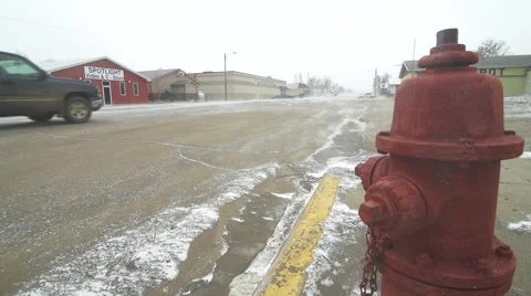 Fire hydrant stands during a snowy windstorm Stock Footage 40320840