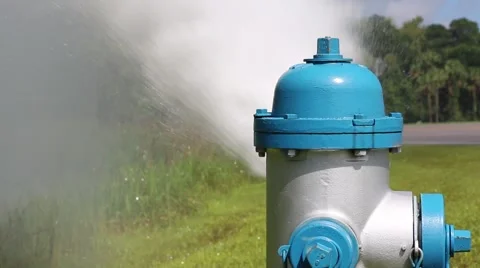 Fire Hydrant under Flushing Maintenance with Cars Passing in Background Stock Footage 52888827