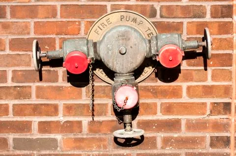 Fire hydrant on wall Stock Photos