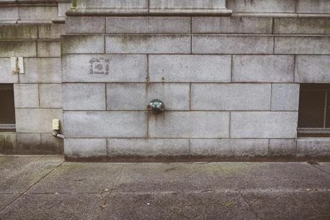 Fire hydrant water pipe, mounted in a building wall. Manhattan USA Stock Photos