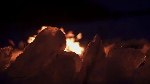 Fire on ice, in the winter, on the frozen river. Stockbeeldmateriaal 72950765