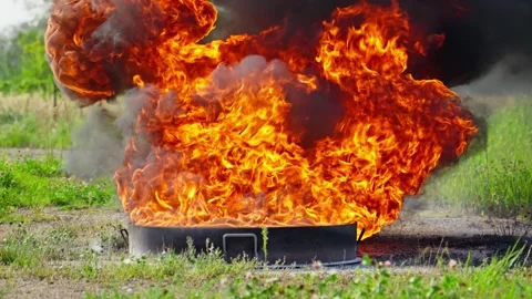 Fire ignites in blaze of vibrant orange flames, creating thick black smoke. Stock-Footage 283891015