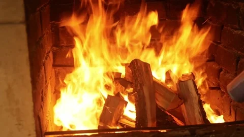 Fire, igniting a fire. Flames in the fireplace, wood for cooking meat. Brick Stock Footage 156598871