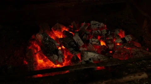 Fire, igniting a fire. Flames in the fireplace, wood for cooking meat. Brick Stock Footage 156599460