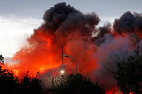 Fire on an industrial warehouse in Asturias, San Andres De Los Tacones, Spain -  Stock Photos
