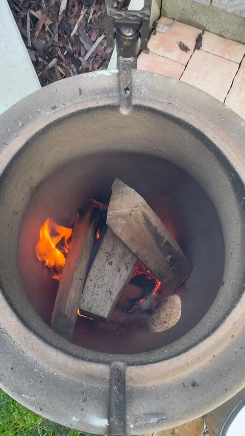 Fire inside tandoor from above (vertical) Stock Footage 319446823