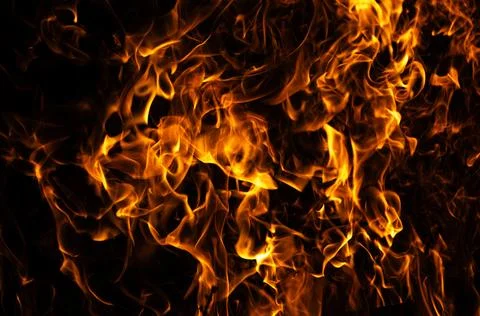 Fire intense flame movement. Fire burning abstract shape. Fire dramatic heat  Stock Photos