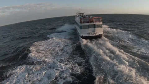 Fire Island Ferry From Behind - FPV Drone (FLAT Color) Stock Footage 240433575