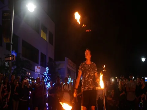 Fire juggler at Ottawa 2017 Glowfair with audience participition Stock Footage 76768576