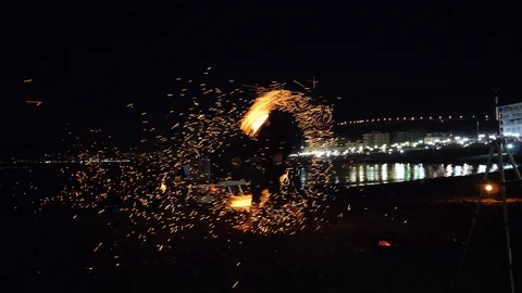 Fire juggler putting on a show  Stock Footage 93442268