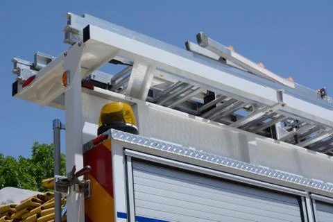 Fire ladder on top of fire engine Stock Photos