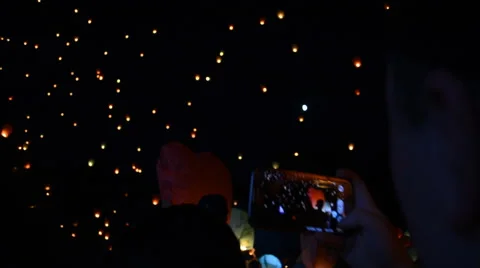 Fire Lanterns. Crowd of People Shooting With Smartphone Stock Footage 65015185
