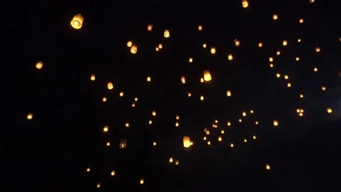 Fire Lanterns Floating up into the sky at night at Loi Krathong Festival Trav Stock Footage 195971047