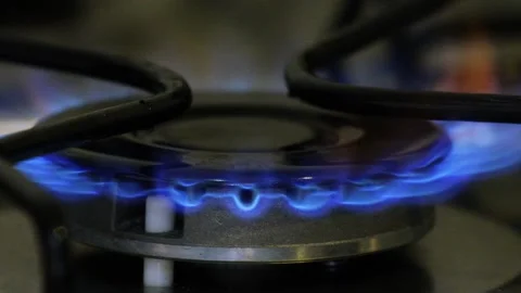 FIRE LIGHTING UP ON THE STOVE IN SLOW MOTION Stock Footage 150337498