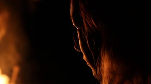 Fire light's up kid's face Stock Footage 122355319