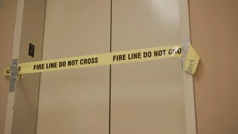 Fire Line Do Not Cross blocking off elevator in building 4k 库存影片 278380428