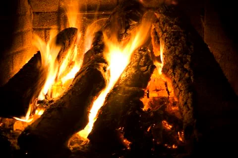 Fire lit in the fireplace Stock Photos