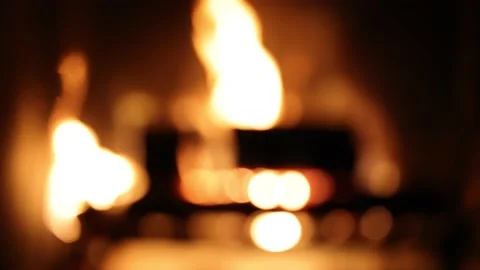 Fire logs burning in the home fireplace, defocused blurred background. Video stock 168907689