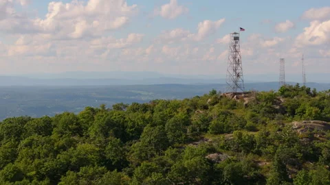 Fire lookout tower fly by on Mount Beacon in New York with Hudson River reveal Stock Footage 346405994