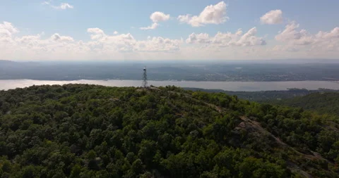Fire lookout tower fly by on Mount Beacon in New York Stock Footage 346406899