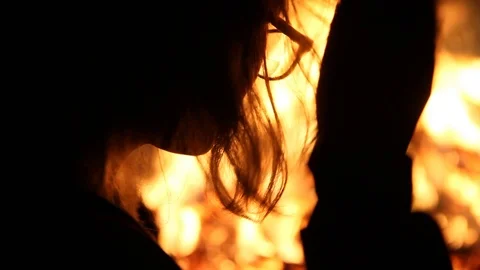 The fire makes it too hot to wear a beanie Stock Footage 122307517