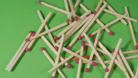 Fire matches on a green background close-up. 4K video. 스톡 동영상 140634227