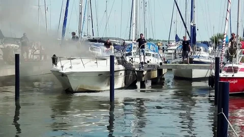 FIRE on motorboat in the port  Video stock 79893393