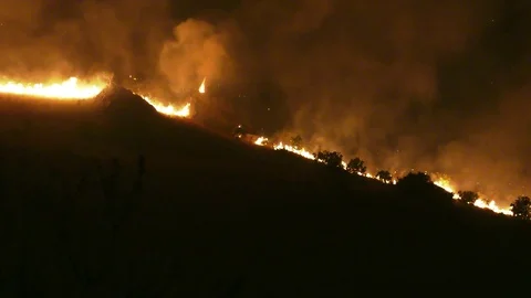 Fire on mountains at night shot 2 Stock-Footage 80964502