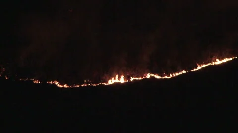 Fire in the mountains - slight pan right Stock Footage 33633331