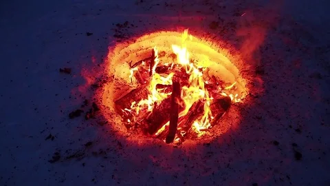 Fire in the mountains in the snow Stockbeeldmateriaal 74098439