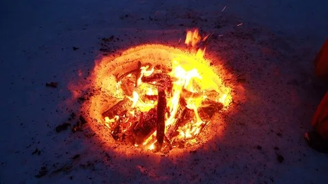Fire in the mountains in the snow Видео 74254251