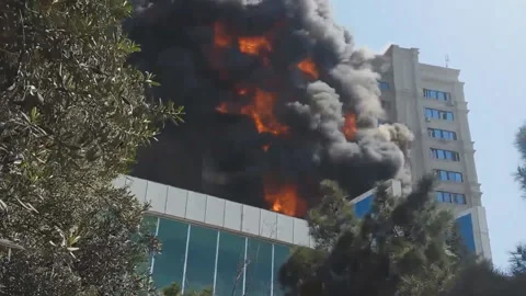 Fire in a multi-storey building during the day Stock Footage 133534423