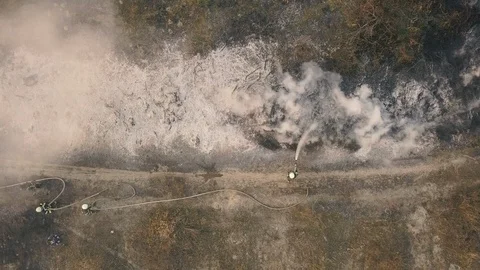 Fire on the nature. A column of smoke rises above the burning grass Stock-Footage 127380371