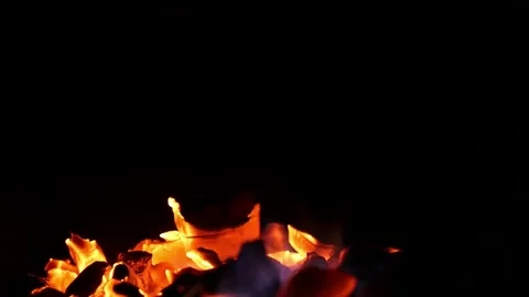 Fire in the night on black background. Bokeh from the fire changes focus to Stock Footage