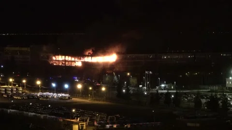 Fire night. burning big building workshop factory office. flashers fire engine Видео 144425359