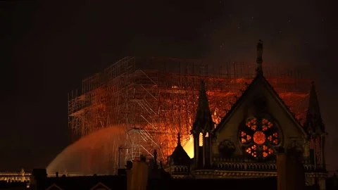A fire in Notre-Dame de Paris, France, and the entire building seriously damaged Stock Footage 166765718