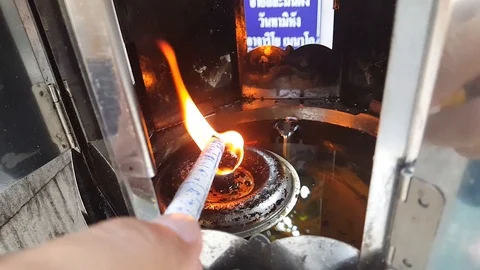 Fire from oil lamps in the temple. Stock Footage 121069471
